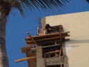 A workman applying stucco